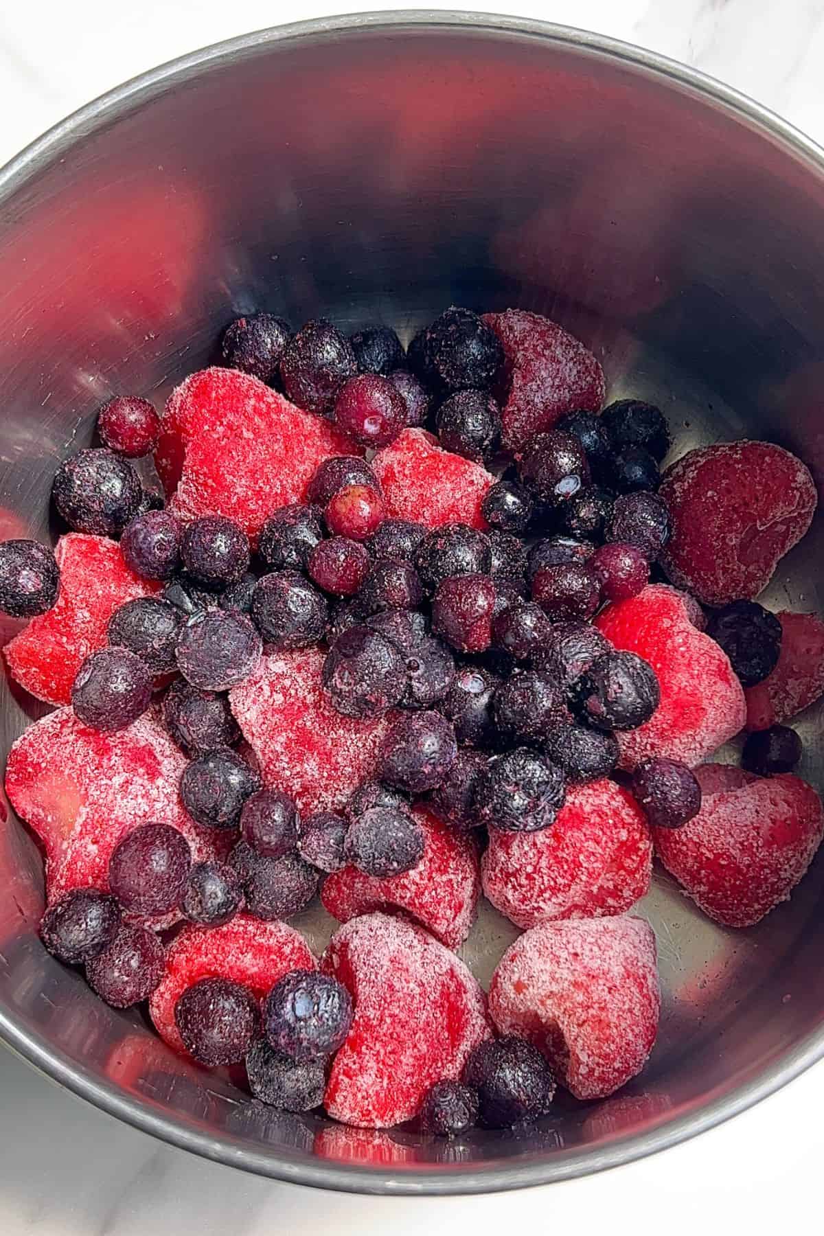 Frozen berries in a saucepan.