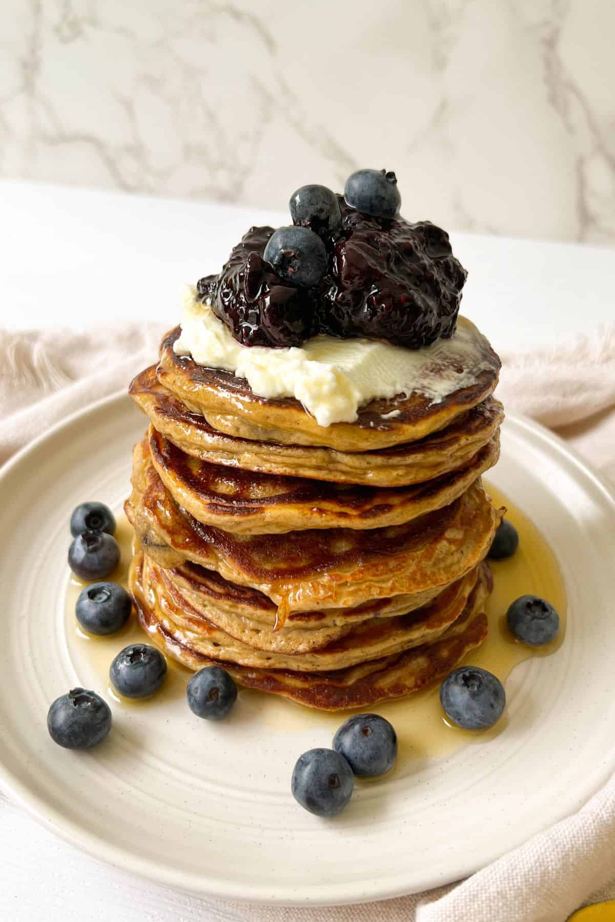 blueberry chia seed jam on a stack of pancakes