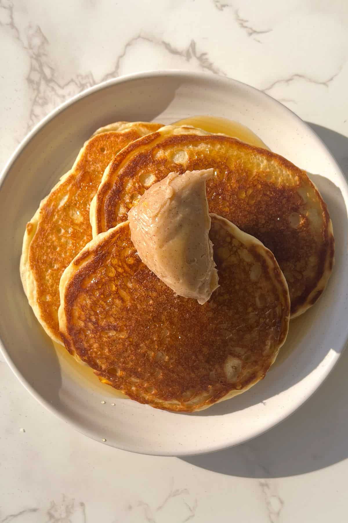 stack of buttermilk protein pancakes with butter and syrup