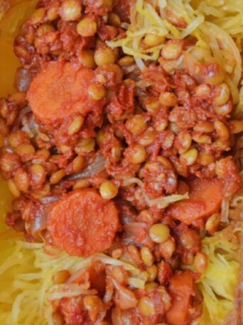 lentil bolognese with carrots served in a spaghetti squash