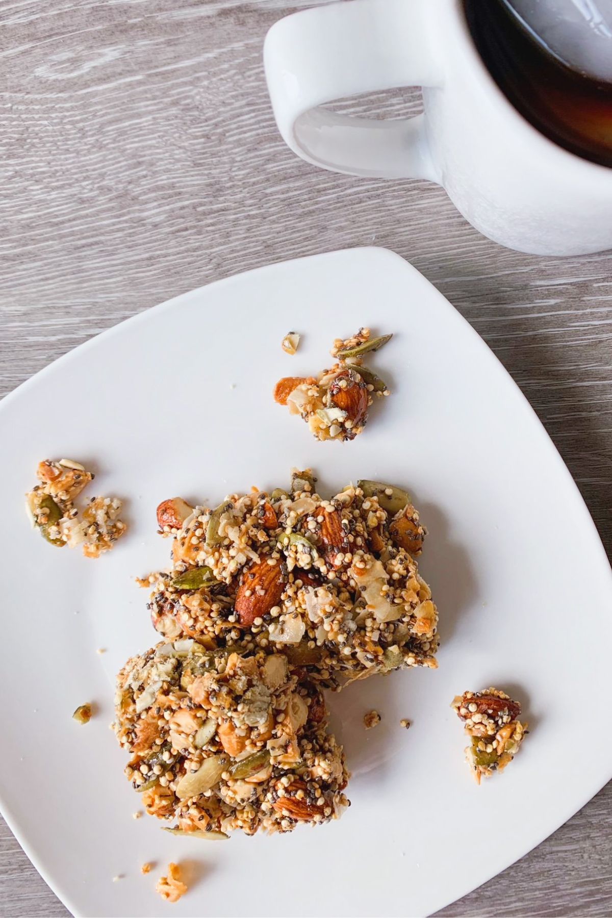 Nut and Seed Bars on a plate with Coffee for an easy breakfast.