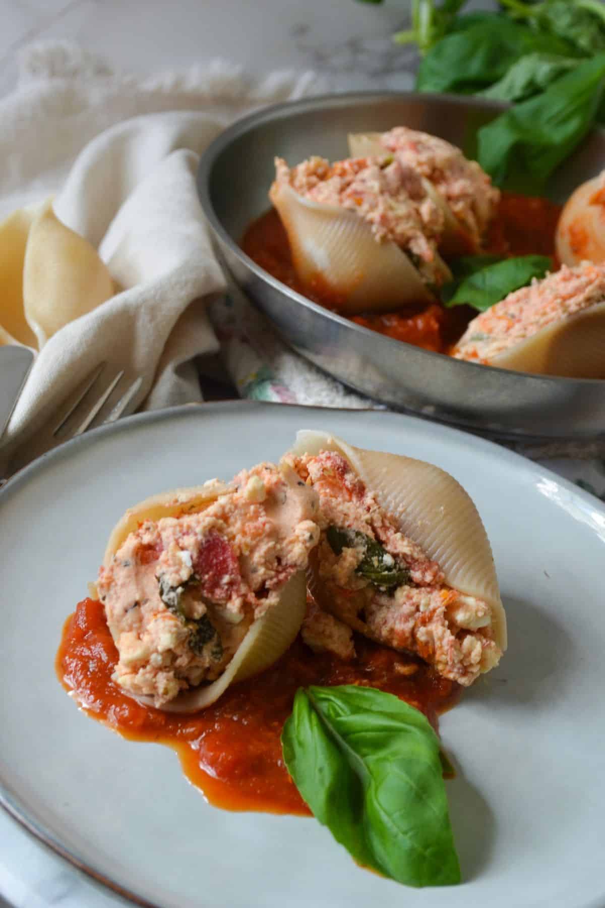 gluten free stuffed shells with feta and tomato on a plate