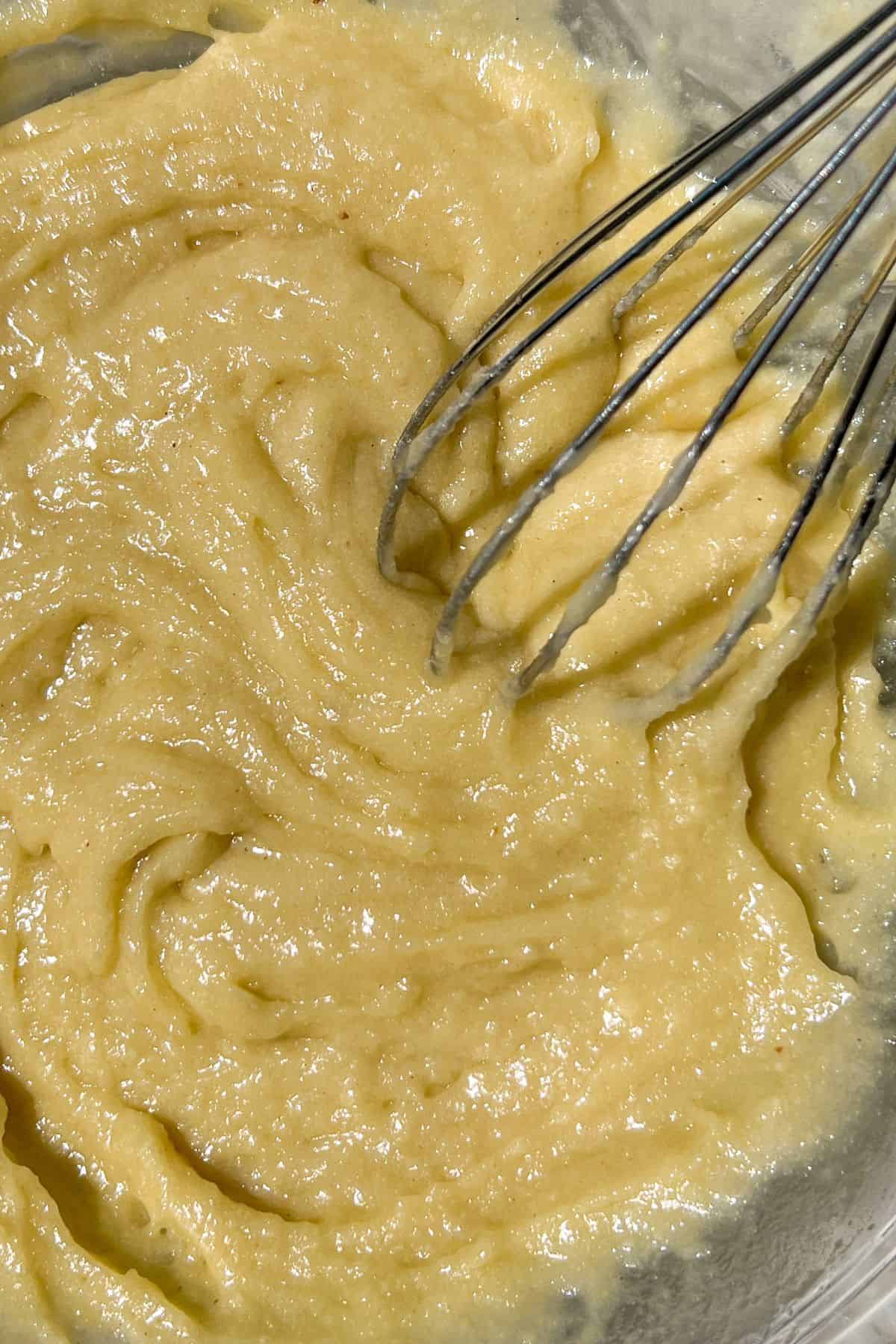 Vegan olive oil cake batter in a bowl.