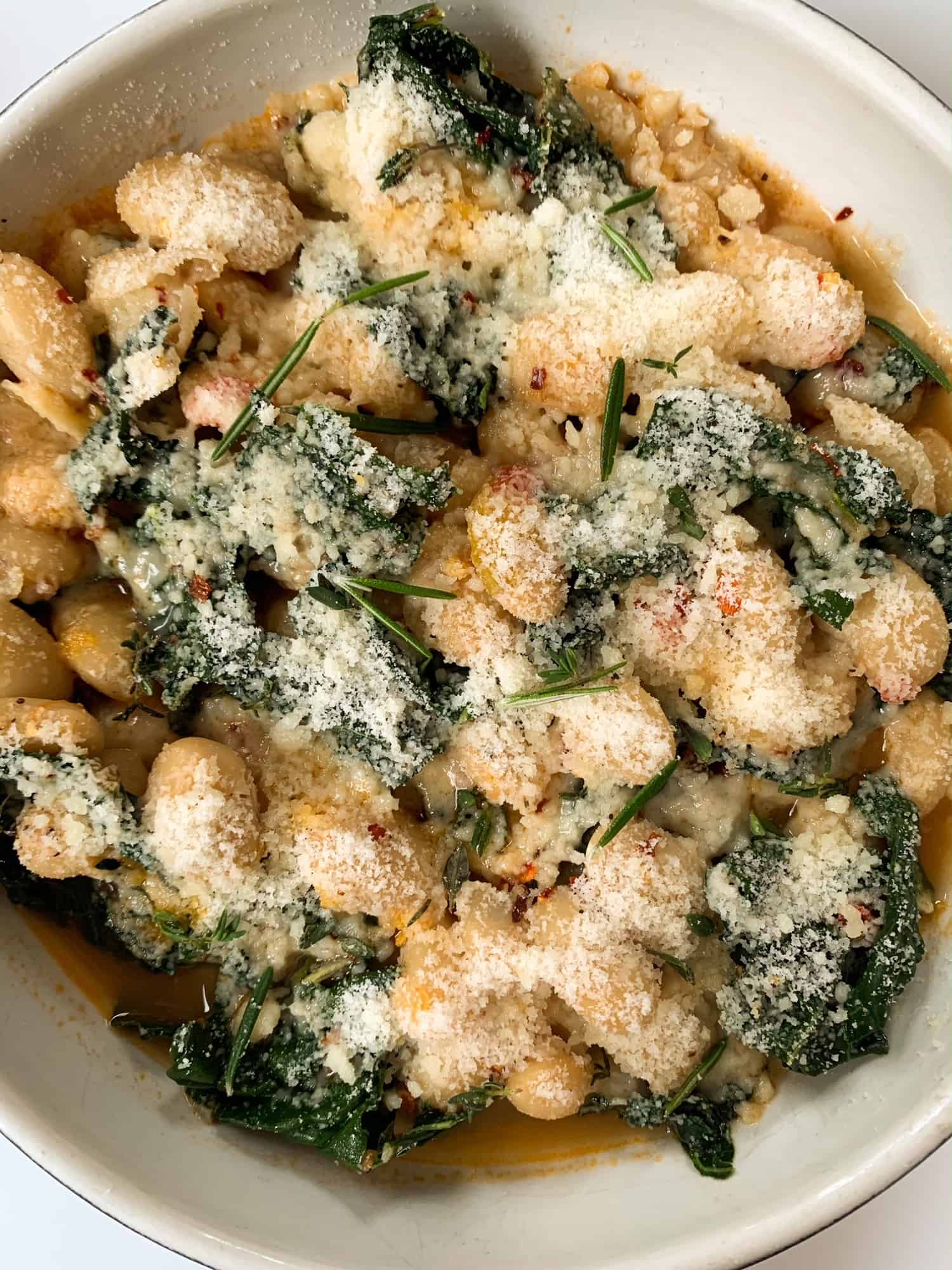bowl of beans and kale with cheese