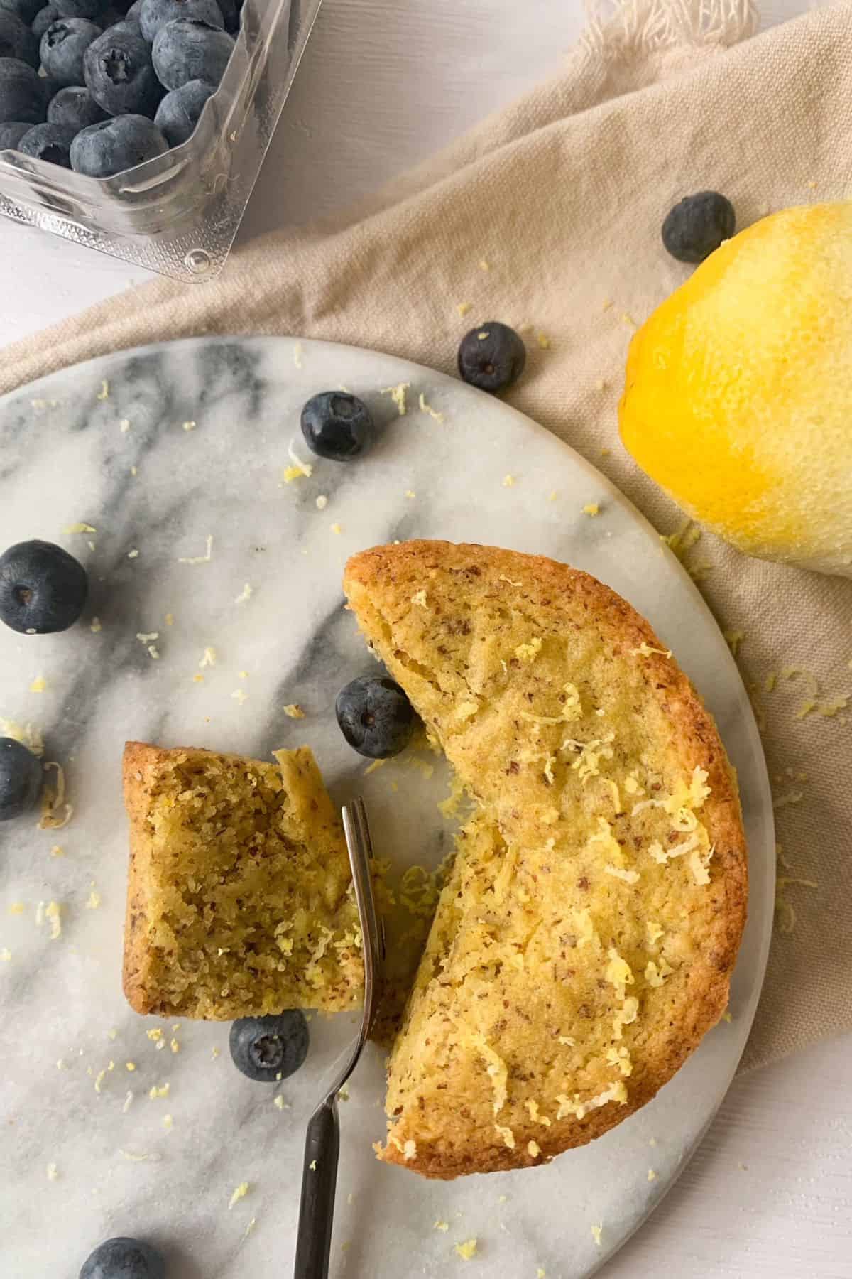 slicing the vegan lemon olive oil cake