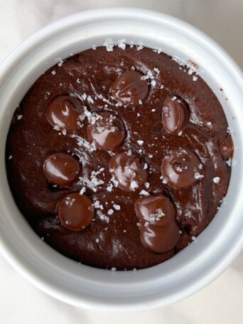 Single Serve Brownie with Protein Powder in a ramekin topped with flakey sea salt.