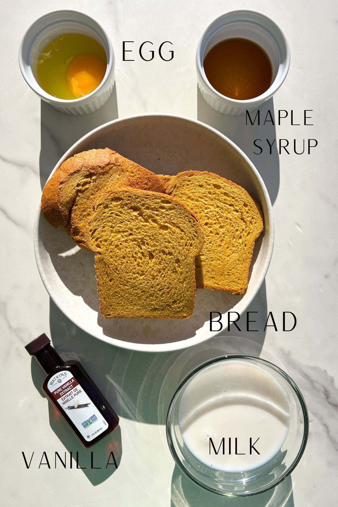 Ingredients measured out in bowls to make Healthy French Toast without Cinnamon.