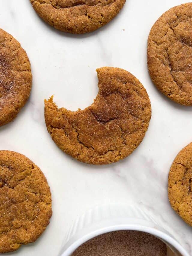 Gluten Free Snickerdoodle Cookies with a bite taken out.