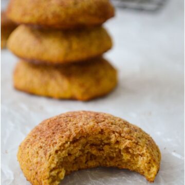 Pumpkin snickerdoodle cookie with a bite taken out of it