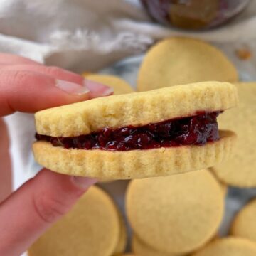 chia seed jam in between two shortbread cookies