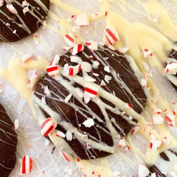 brownie cookie with white chocolate drizzle and crushed peppermint