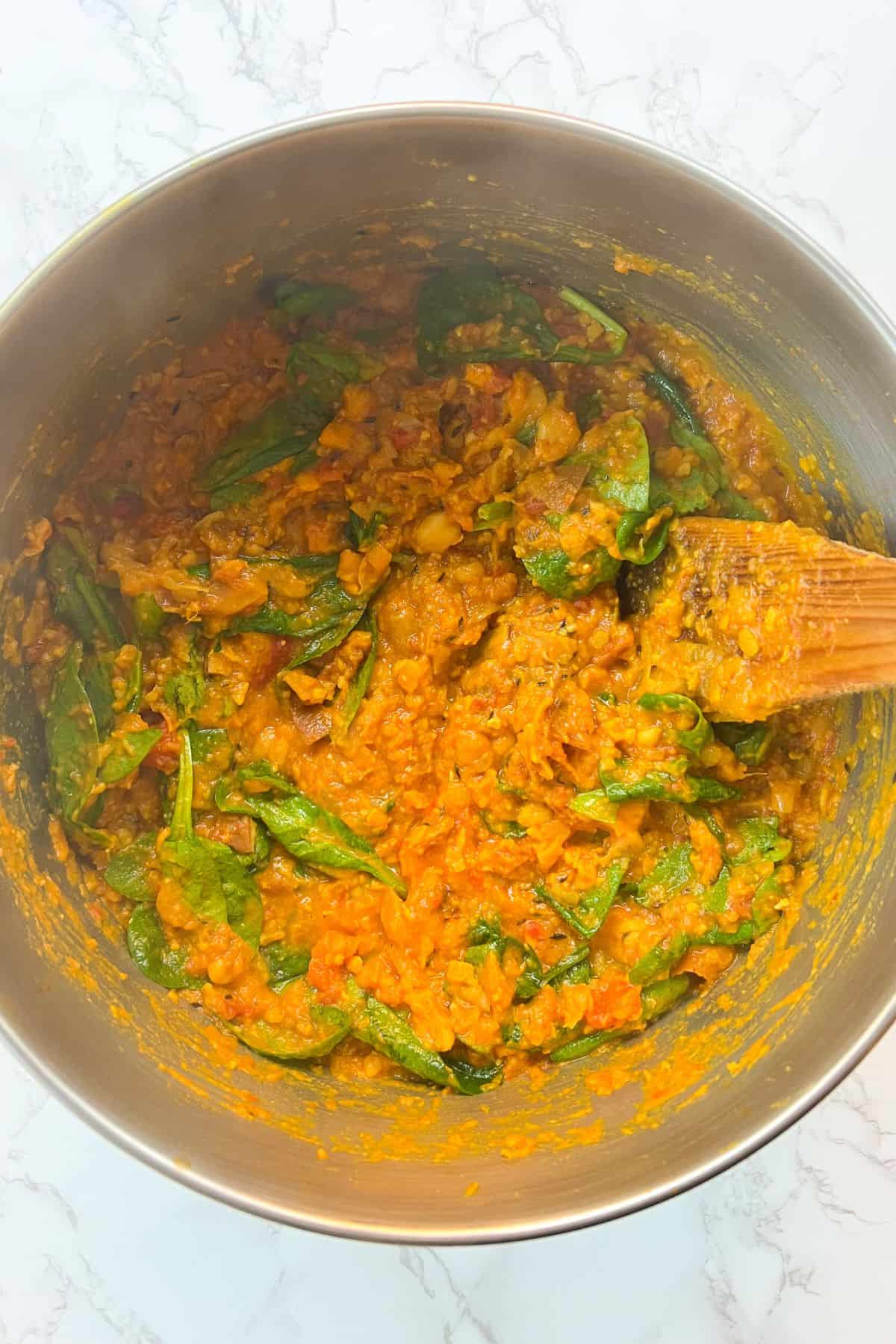 making sweet potato curry in a pot