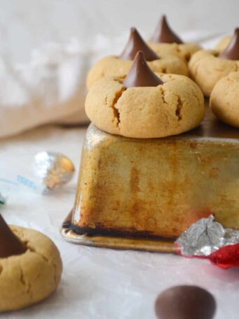 Gluten Free Peanut Butter Blossoms next to each other on a tray.