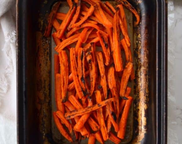 baked carrot sticks in a pan