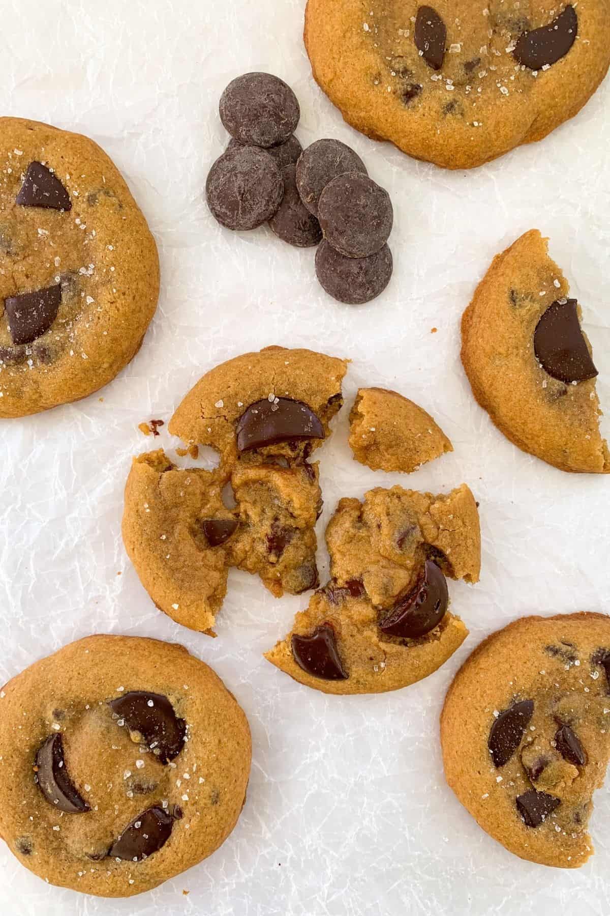 chocolate sea salt cookies with one broken apart in the middle