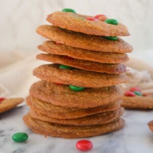 stack of m&m cookies on a plate