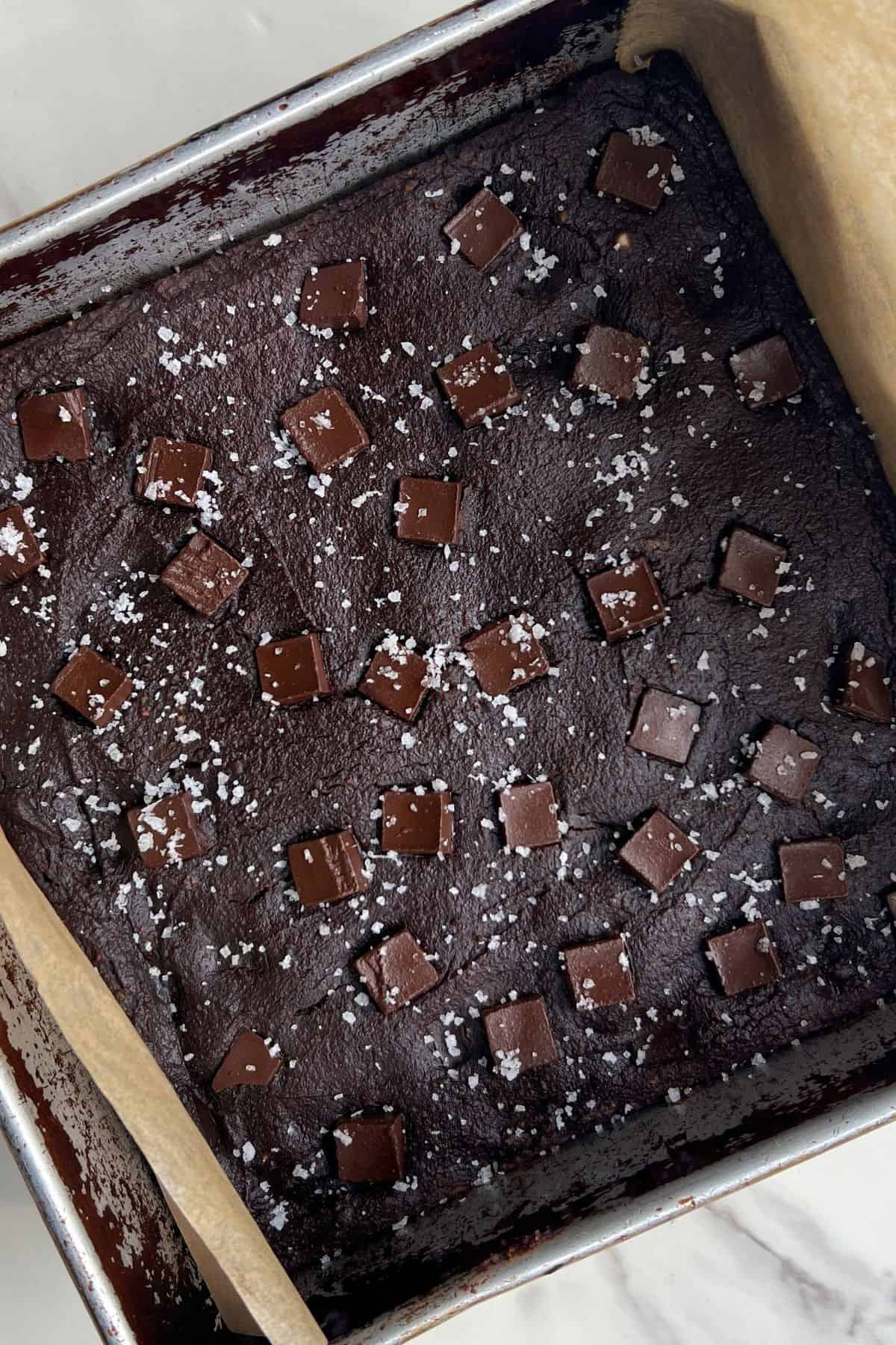 Baked low calorie brownies topped with flaky sea salt.