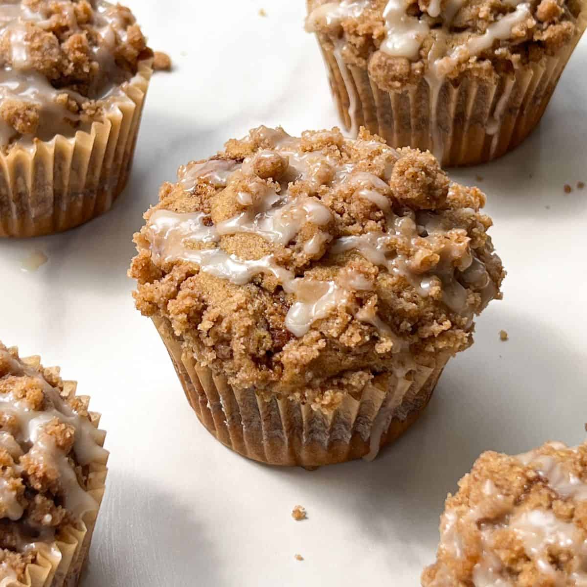 Cinnamon Streusel Muffins topped with Vanilla Glaze