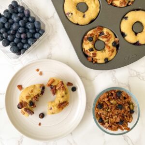 donut on a plate with donut pan next to it
