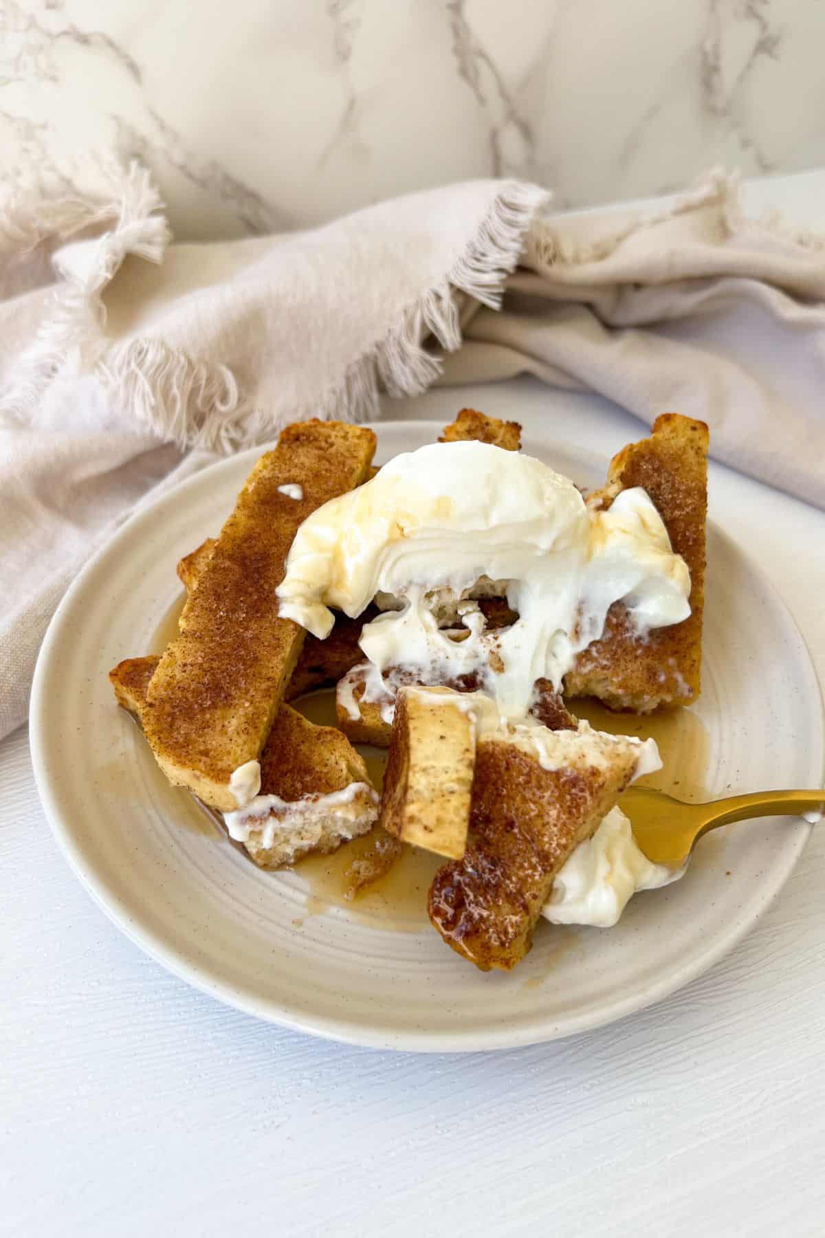 french toast sticks topped with greek yogurt and honey