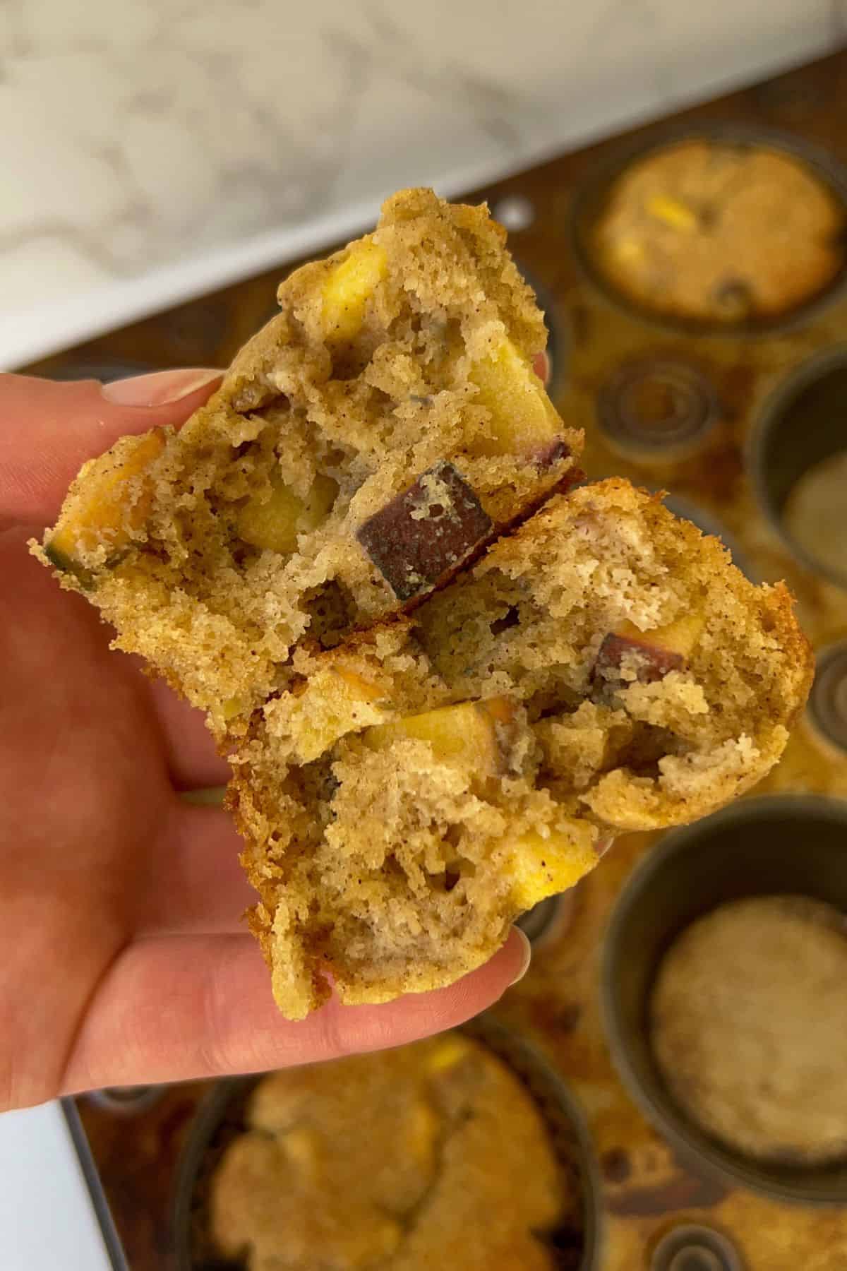 holding a split peach muffin in my hand to show the inside