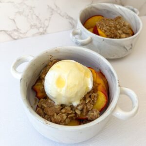nectarine crisp topped with crumble, greek yogurt and honey
