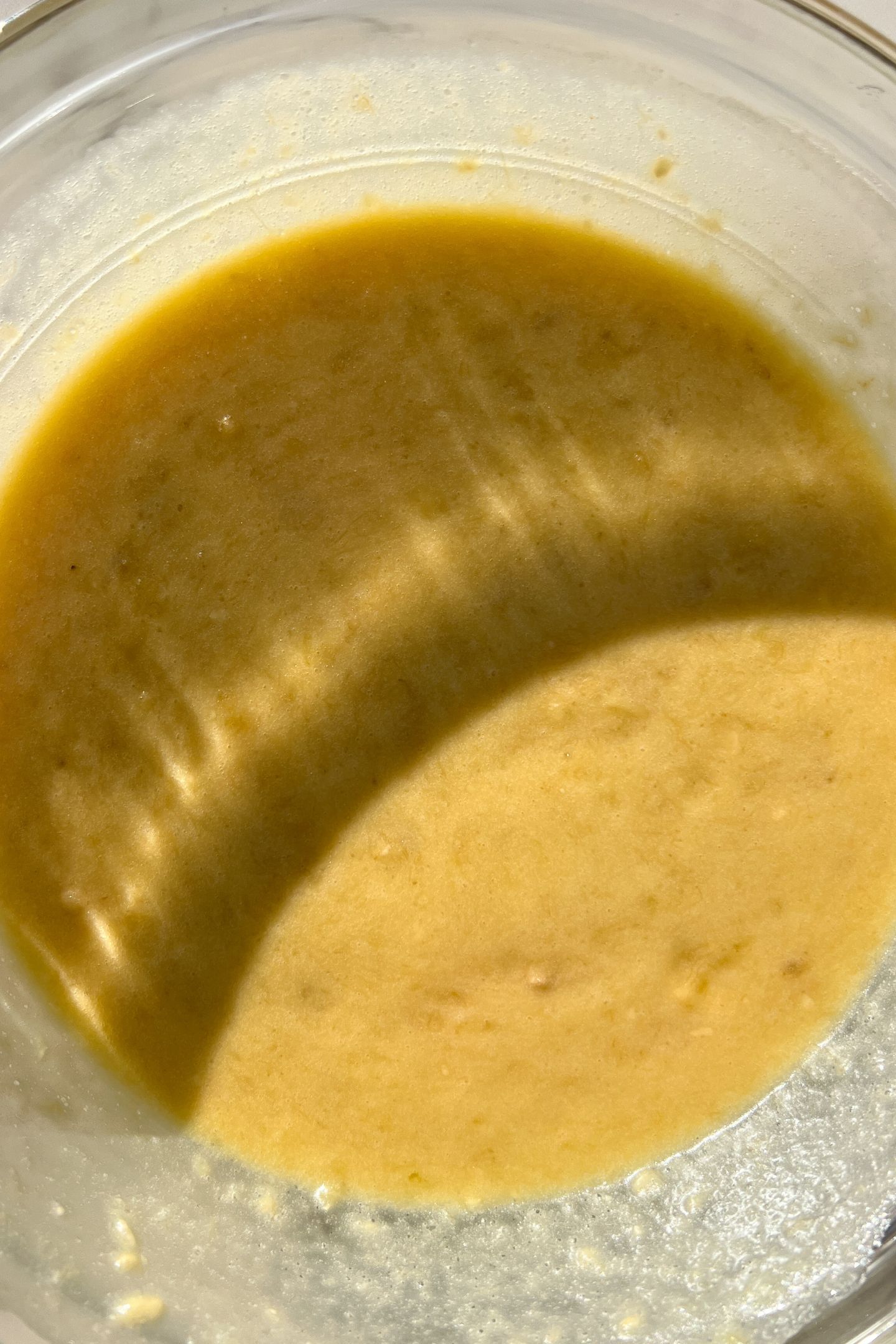 Wet ingredients mixed together in a large mixing bowl.
