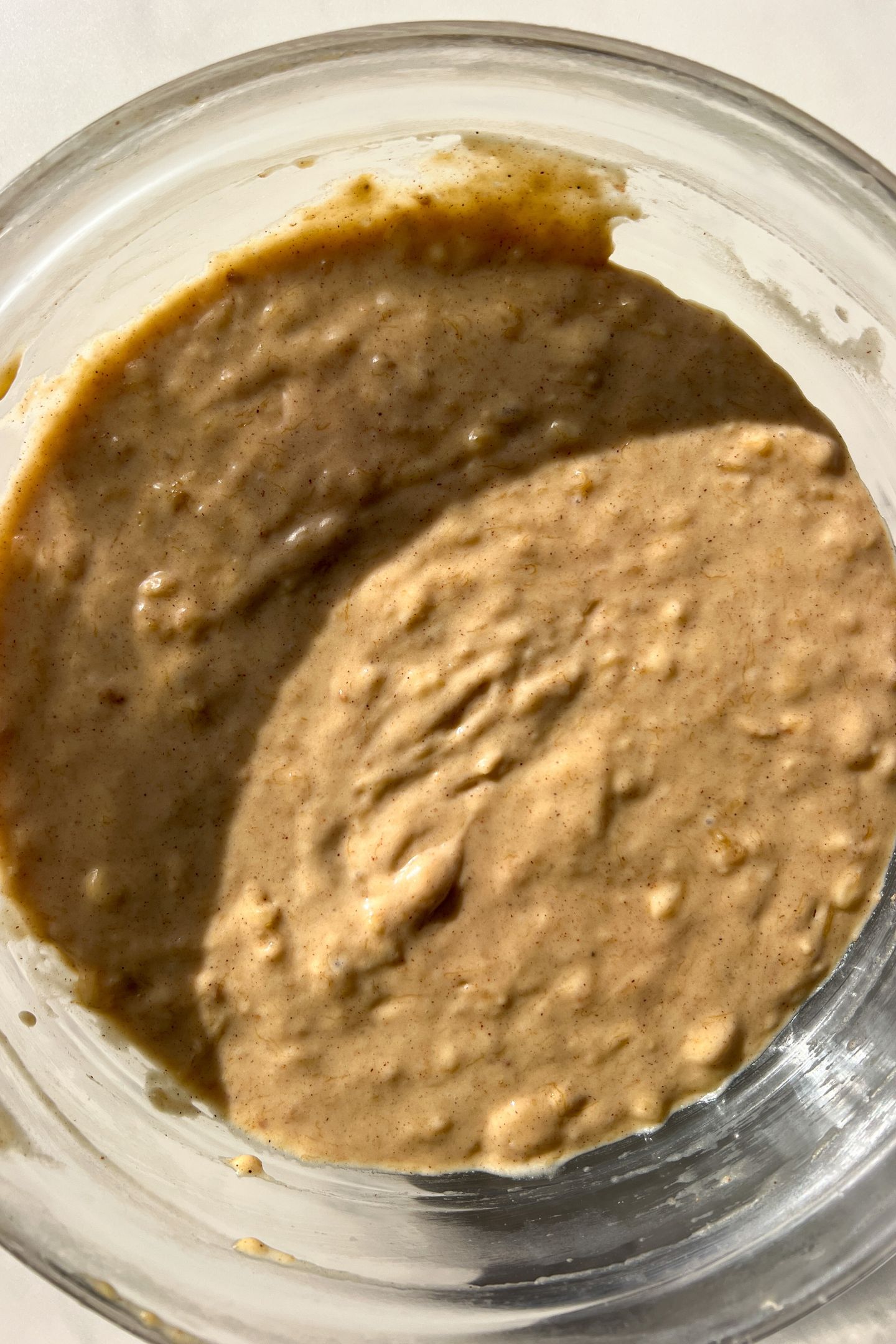 Banana Muffin batter resting in a large mixing bowl.