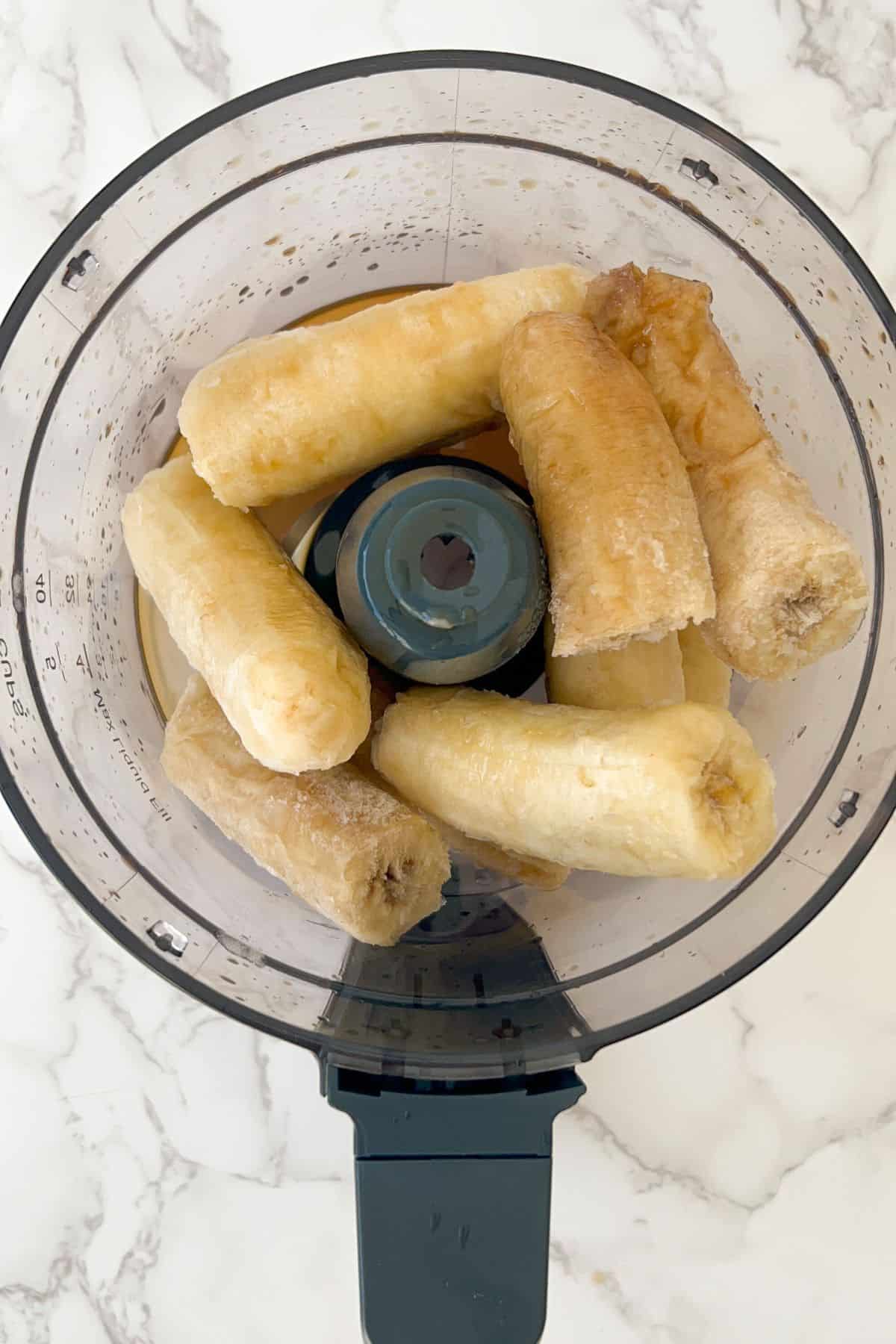 frozen bananas in a food processor to make no churn banana ice cream