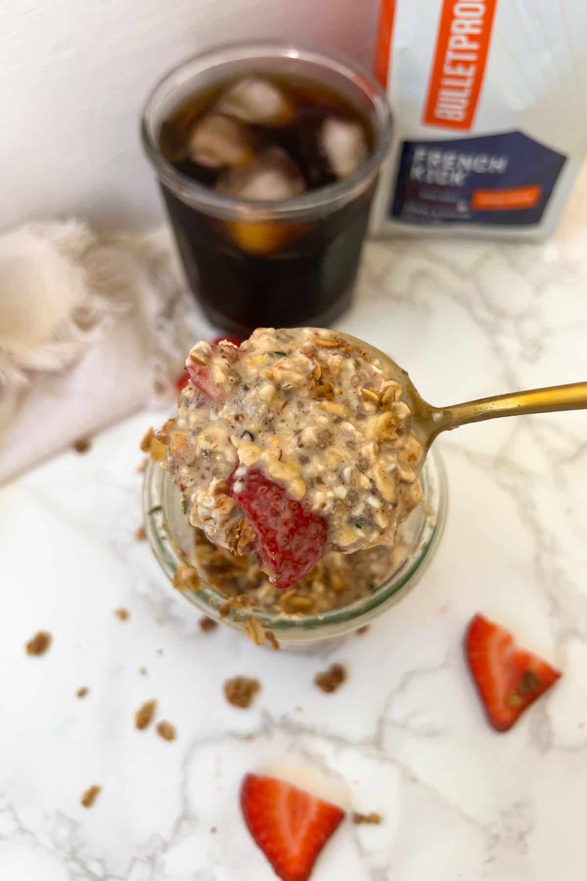 scooping up cinnamon overnight oats