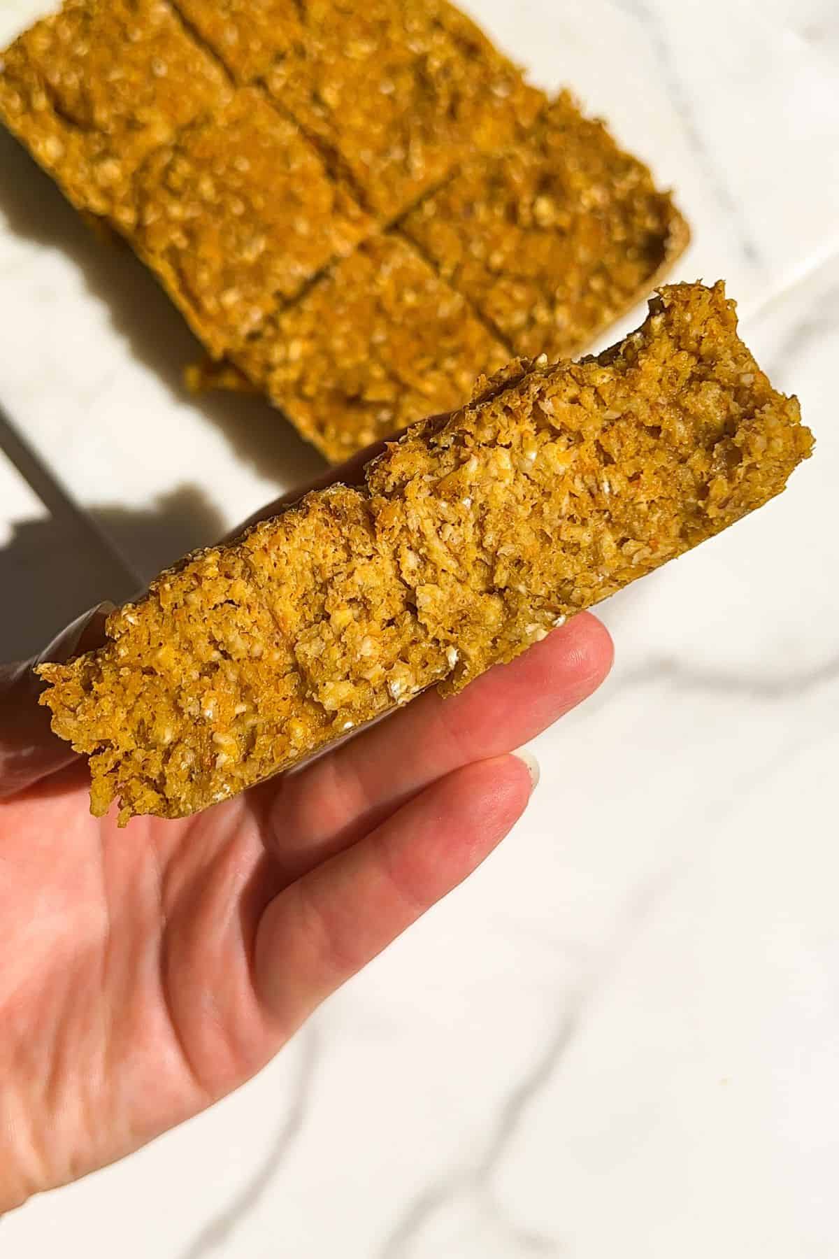 Holding Carrot Cake Baked Oatmeal Bars in my hand.