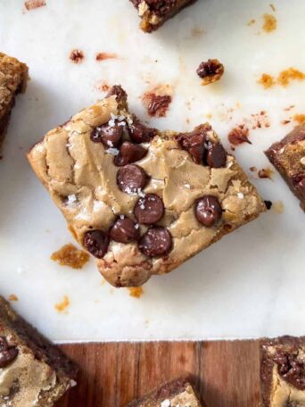 Gluten Free Blondie with a bite taken out of it.