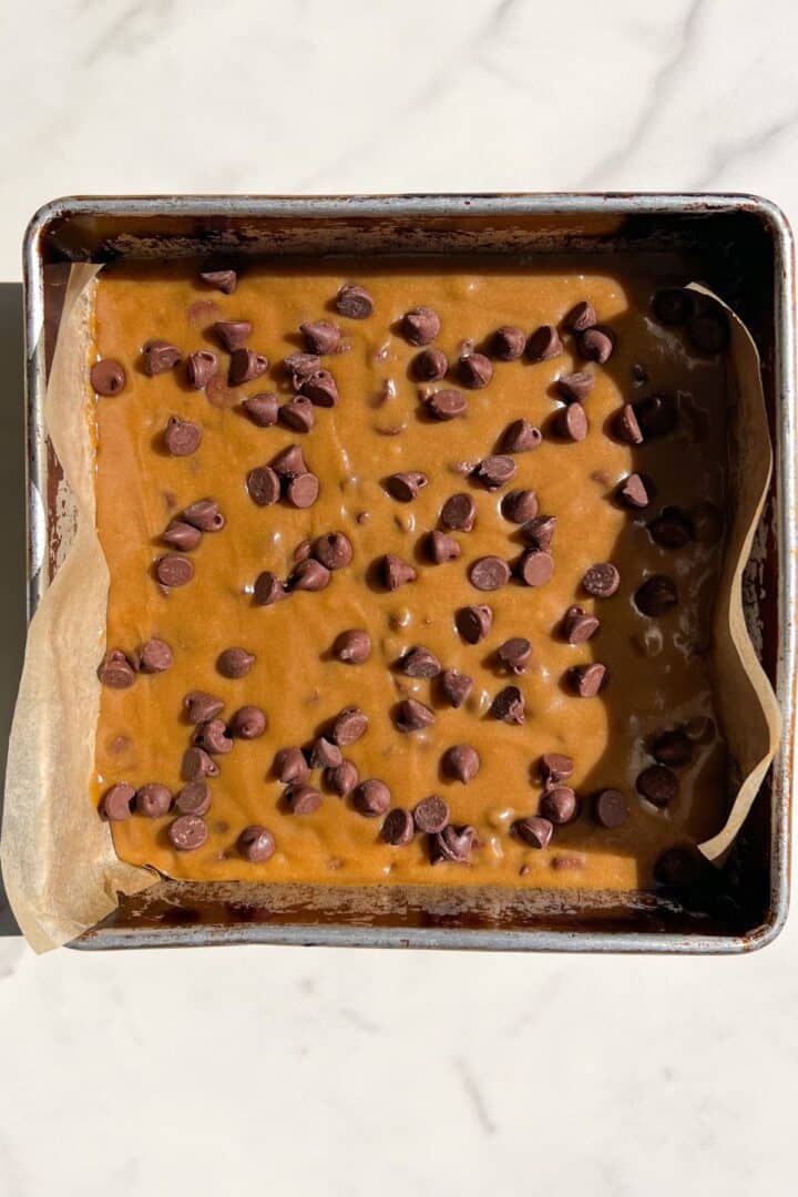 Add extra chocolate chips on the Gluten Free Blondies batter once in the square pan.