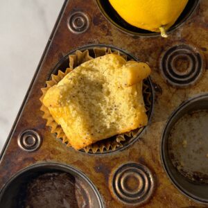 Healthy Lemon Poppy Seed Muffin with a bite taken out of it.