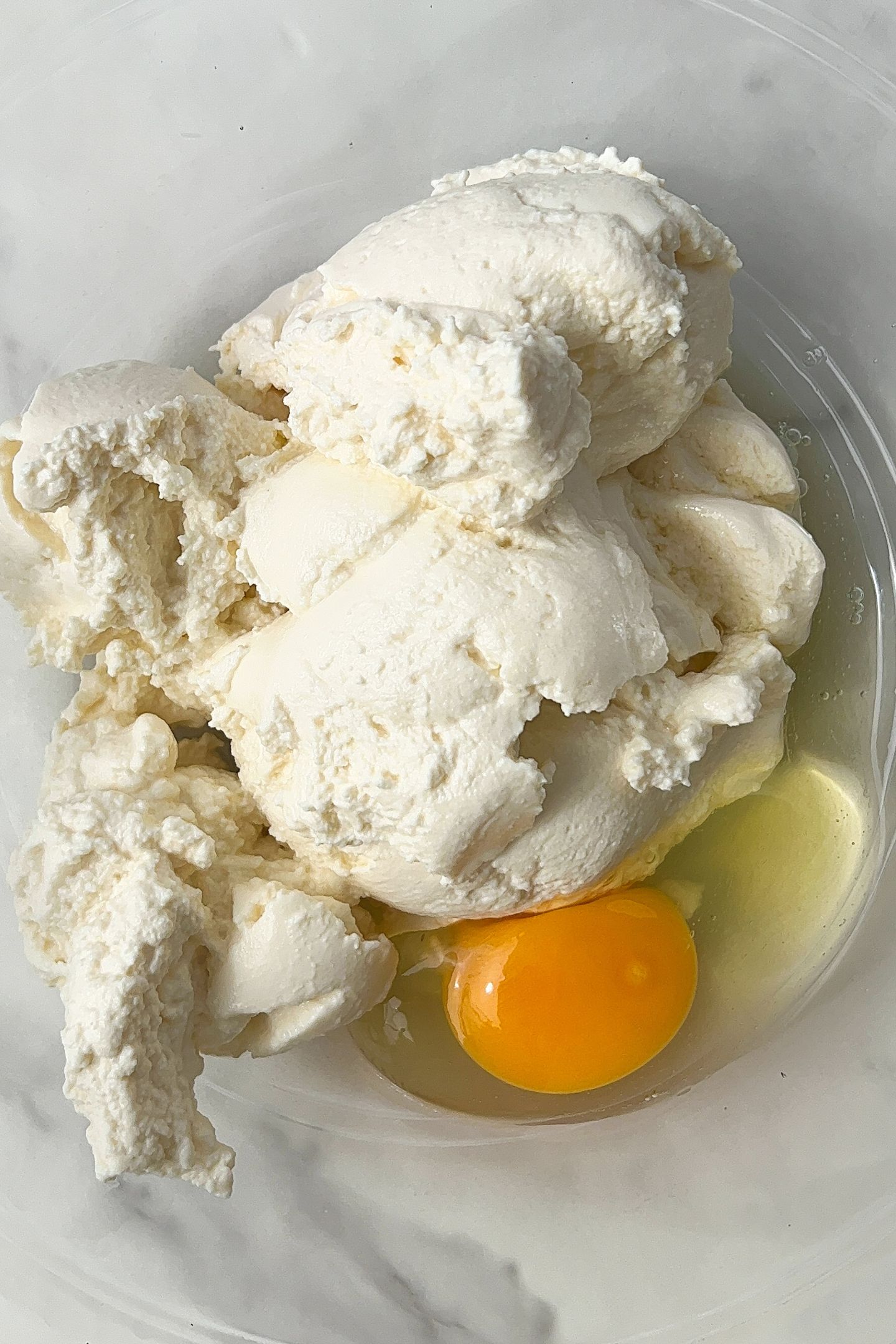 Add the ricotta cheese and eggs to a large mixing bowl