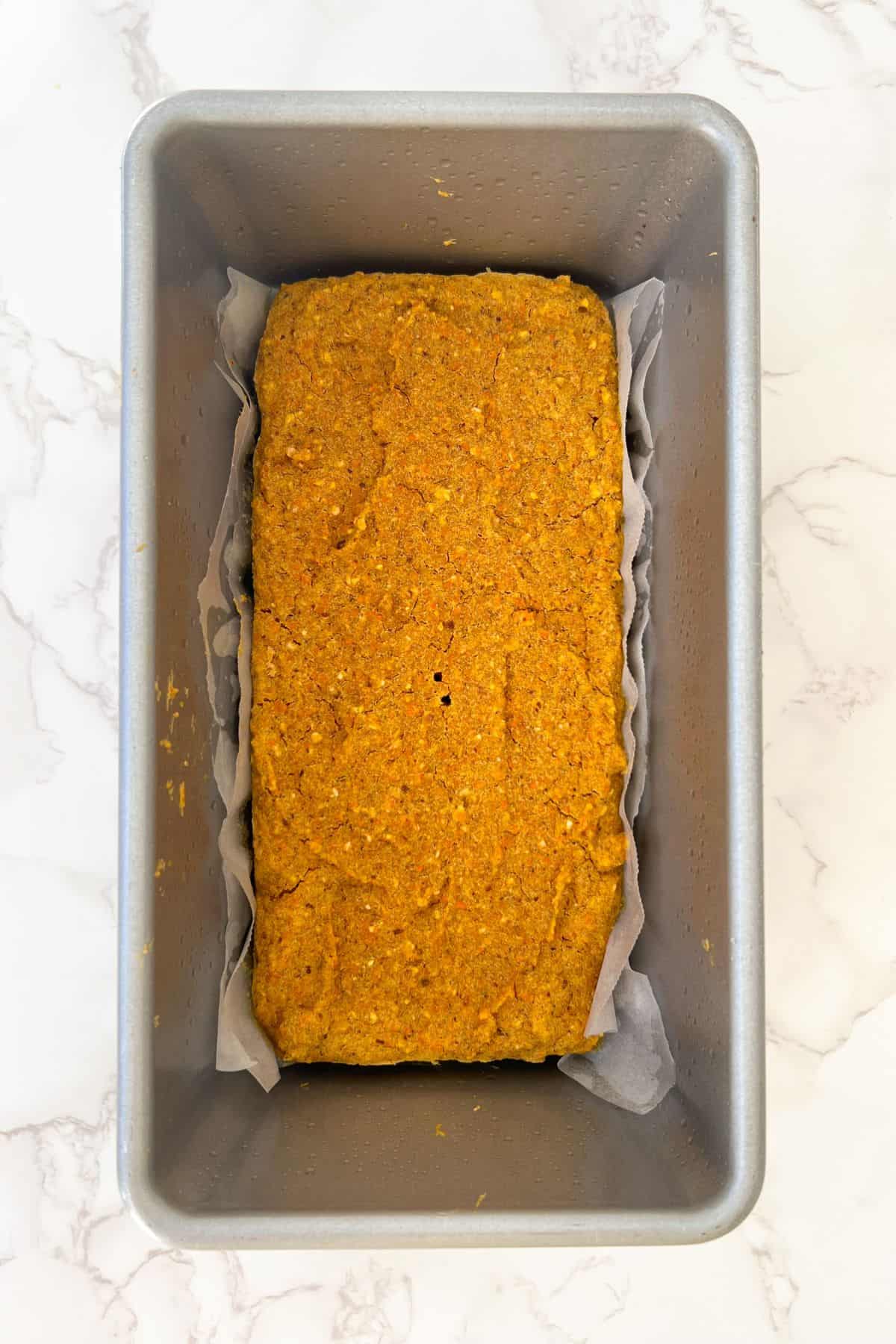 baked carrot cake oatmeal bars in a loaf pan