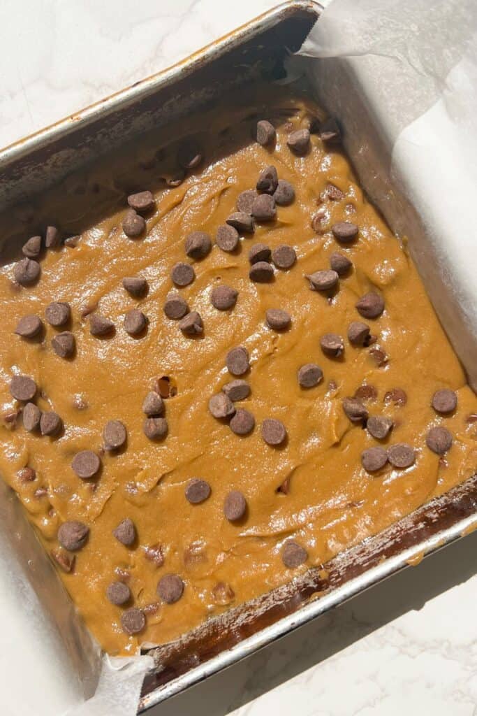 gluten free blondies batter in a 9x9 pan