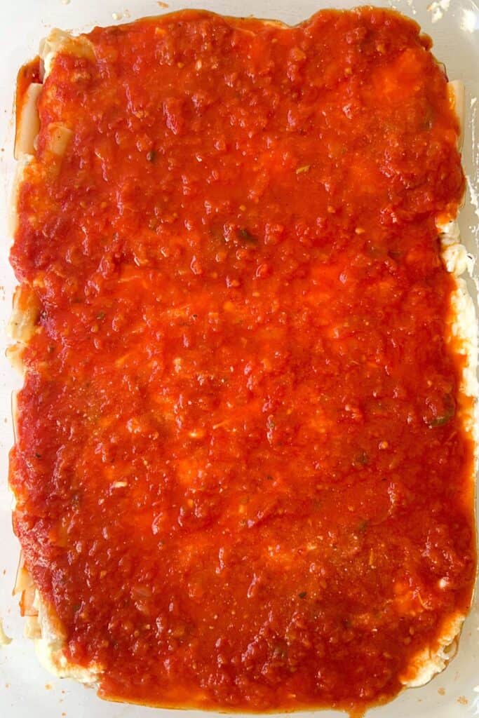 ricotta layer of gluten free ziti topped with pasta sauce