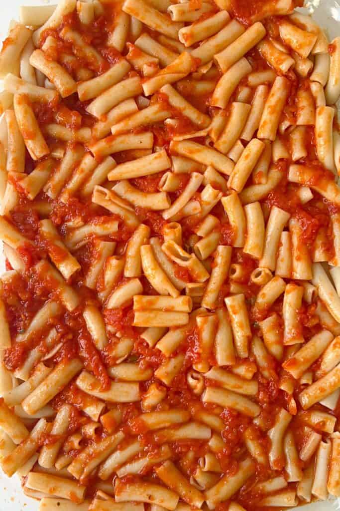 pasta sauce topped with remaining pasta