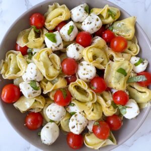 tortellini caprese salad in a serving bowl