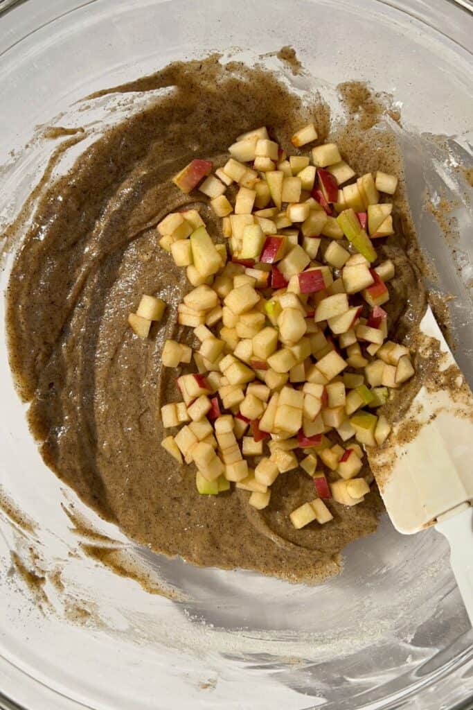 making gluten free apple cider donuts batter in a bowl