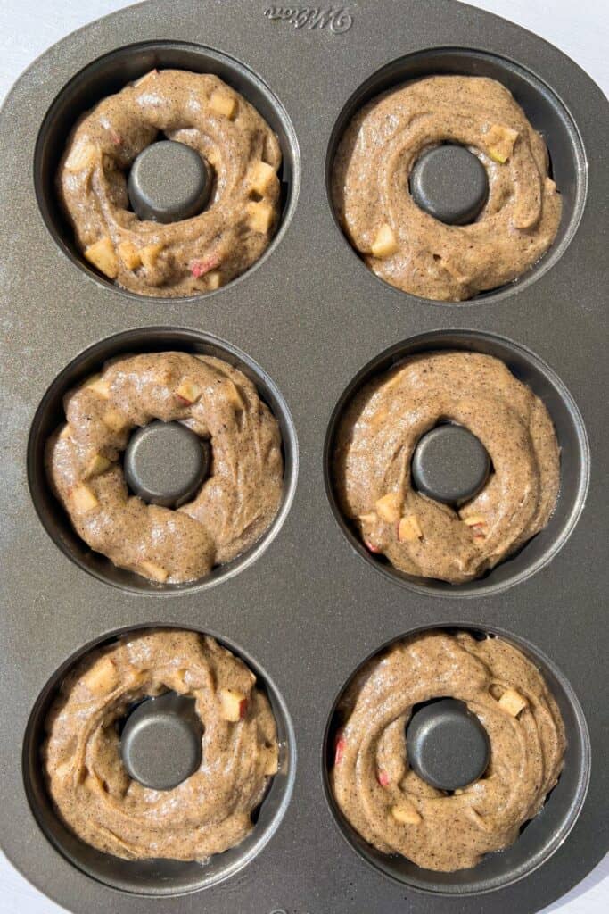 gluten free apple cider donuts batter in a pan
