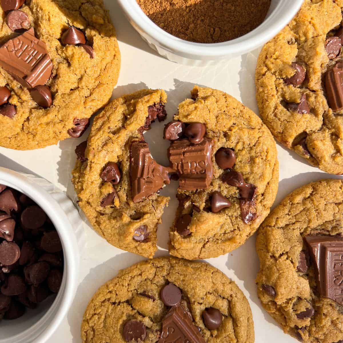 Broken Gluten Free Chocolate Chip Pumpkin cookie with melty chocolate in the middle.