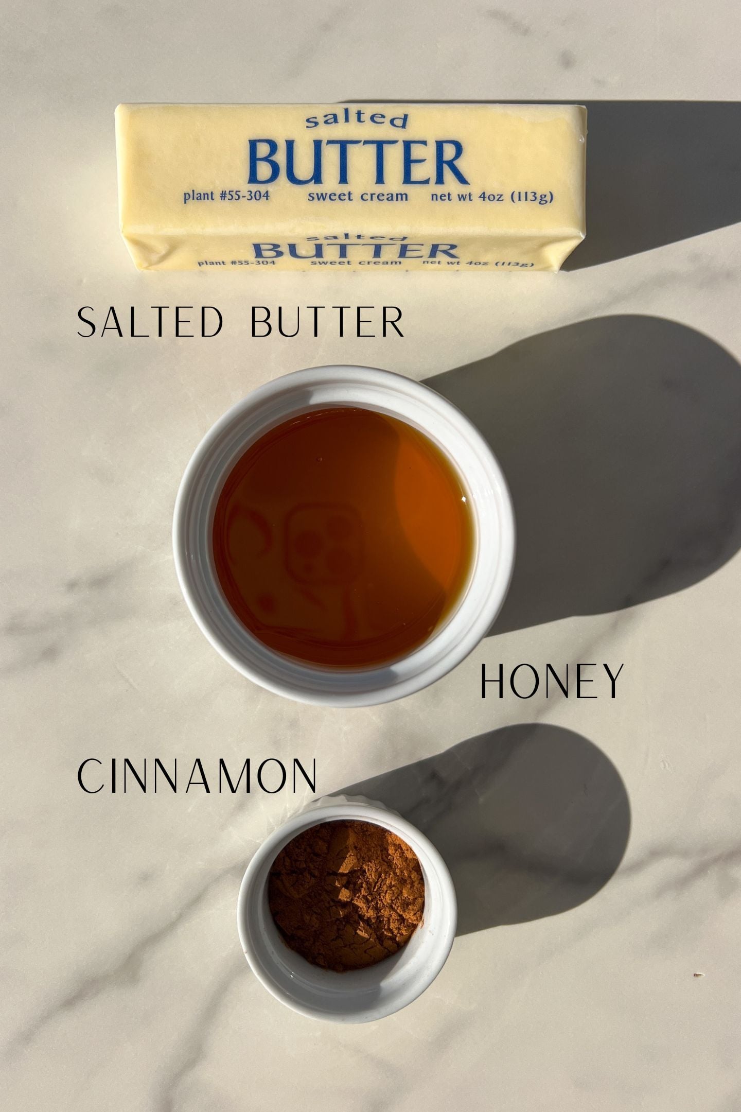 Ingredients measured out to make whipped honey cinnamon butter.