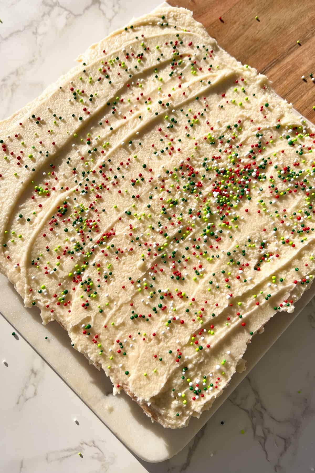 gluten free cookie cake topped with frosting and sprinkles