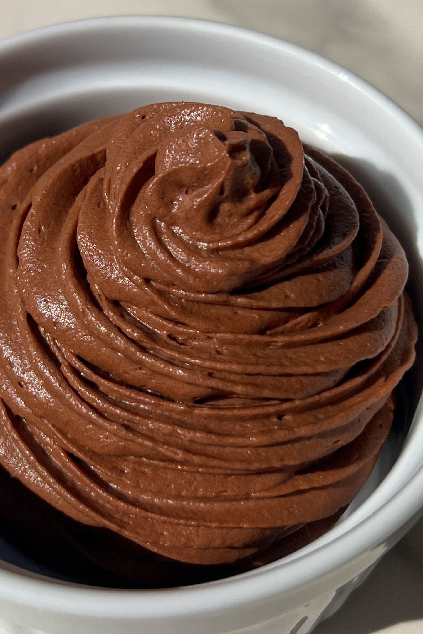 Chocolate frosting piped in a bowl.