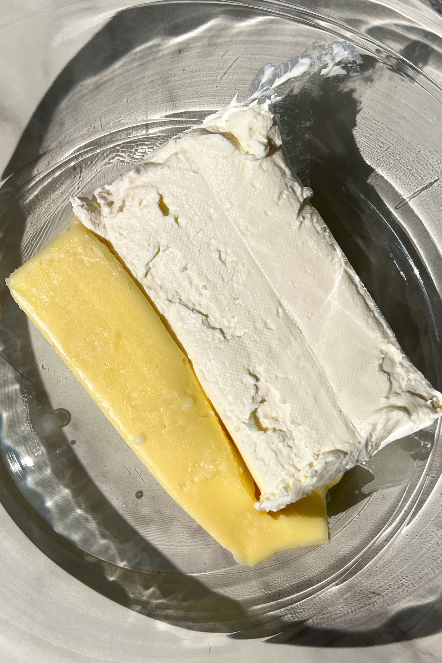Butter and cream cheese in a bowl.