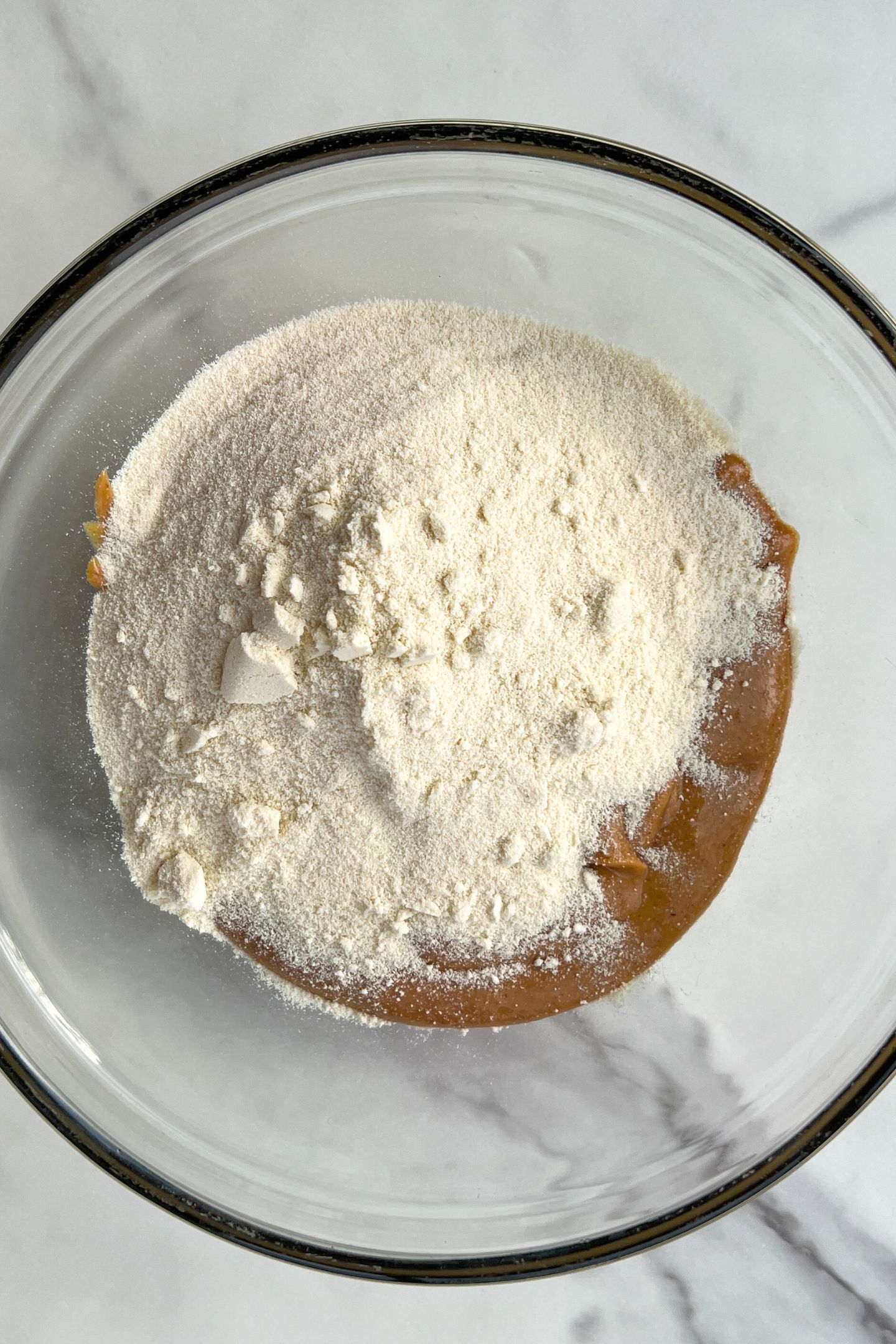 Peanut butter in a bowl with protein powder.