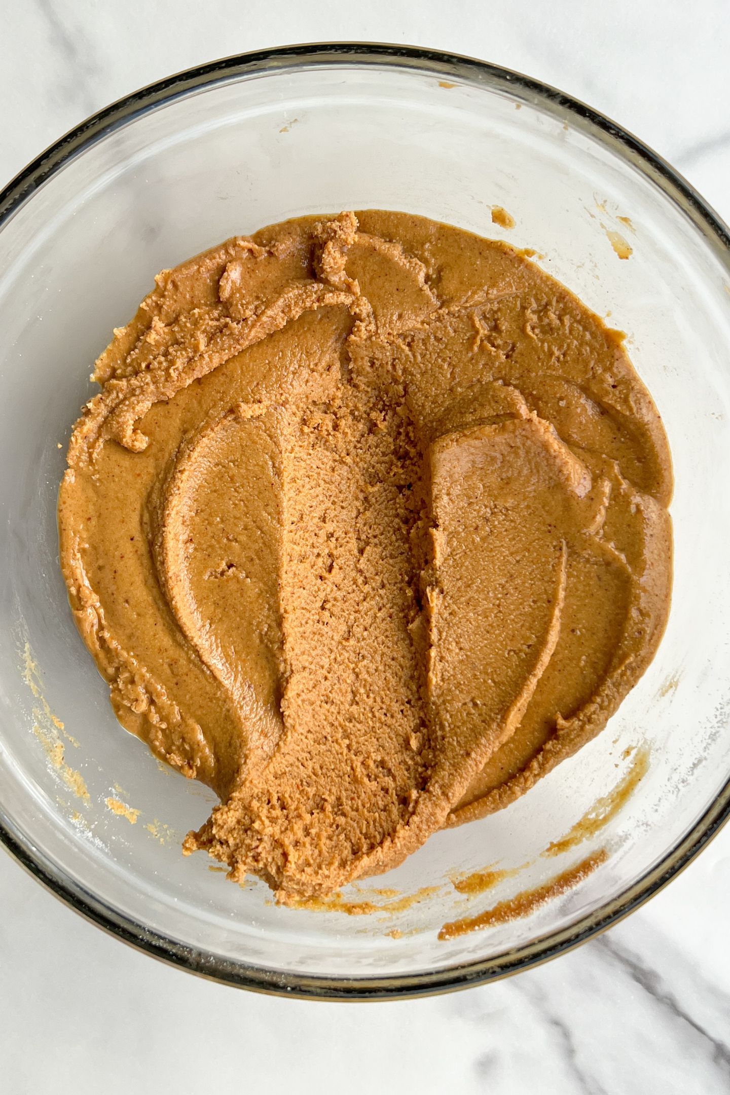 Peanut butter in a bowl with protein powder mixed together.