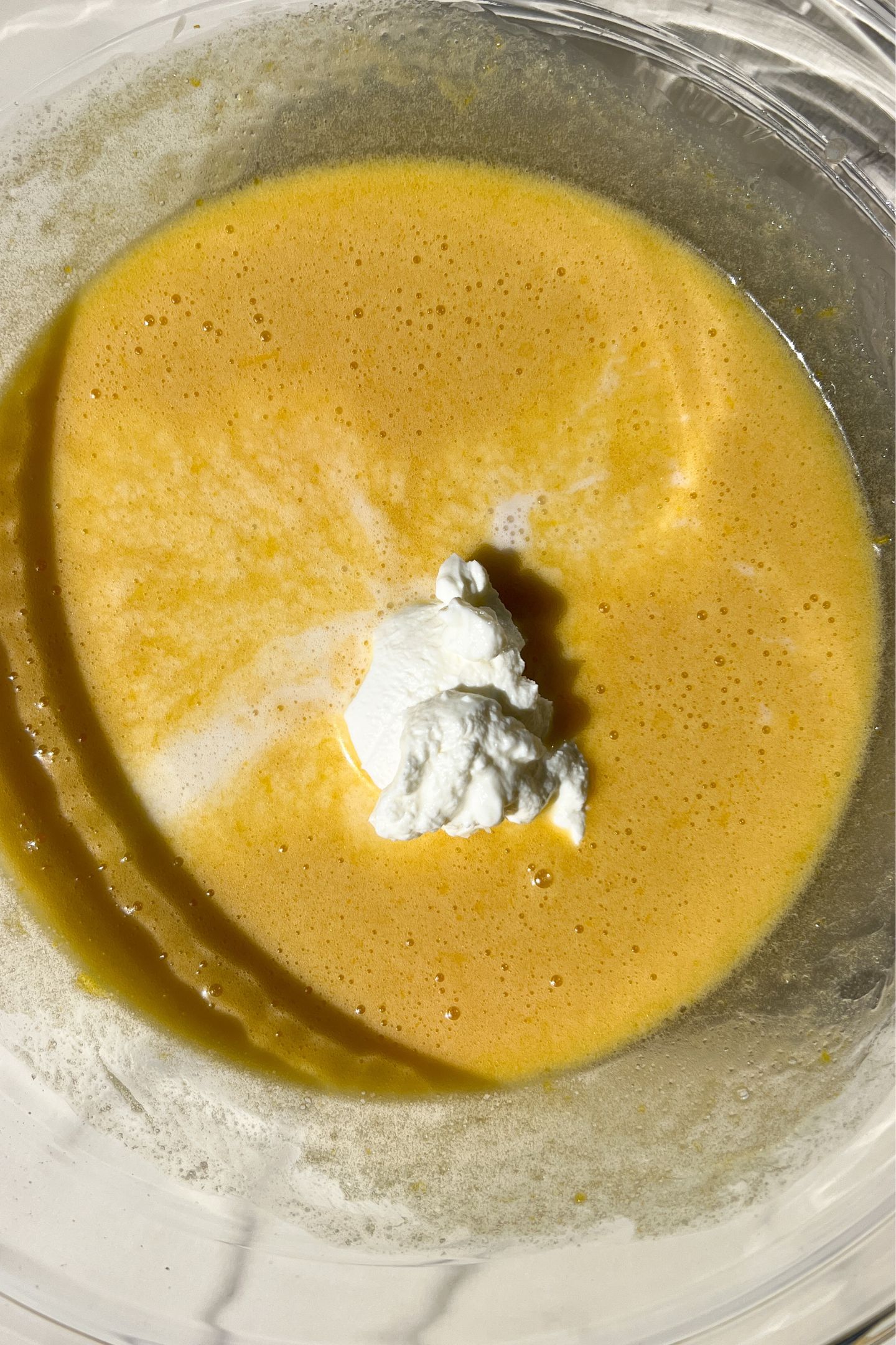 Mixing wet ingredients in the bowl.